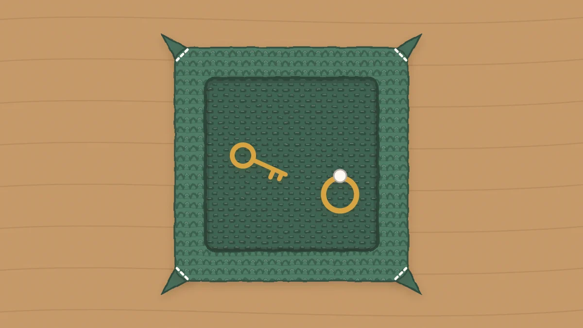 A small square crochet tray with pinched corners holding a set of keys and a ring