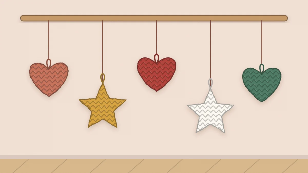 Three crochet hearts and two crochet stars hanging on cords at different heights