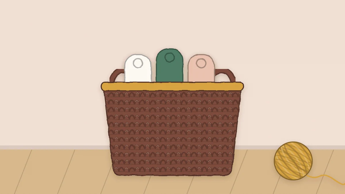 A sturdy crochet basket with two handle openings holding rolled towels