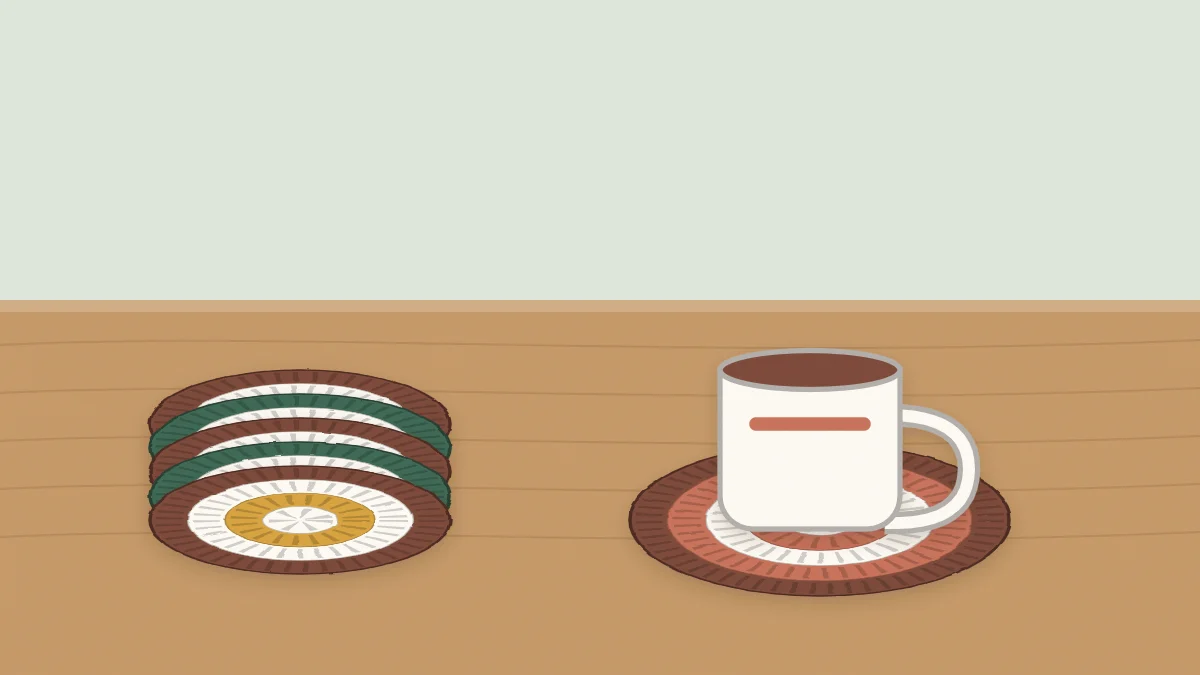 A stack of round crochet coasters next to a mug resting on a matching coaster