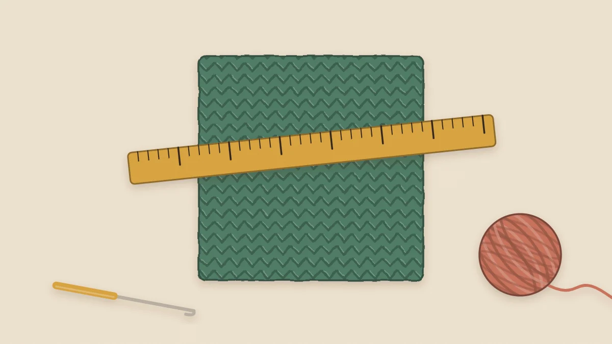 A textured crochet gauge swatch with a tape measure laid across it